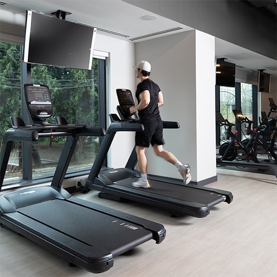Man running on a treadmill in the gym