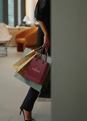 Woman with shopping bags in building lobby