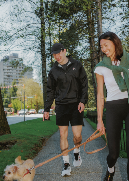 Man and woman walking dog