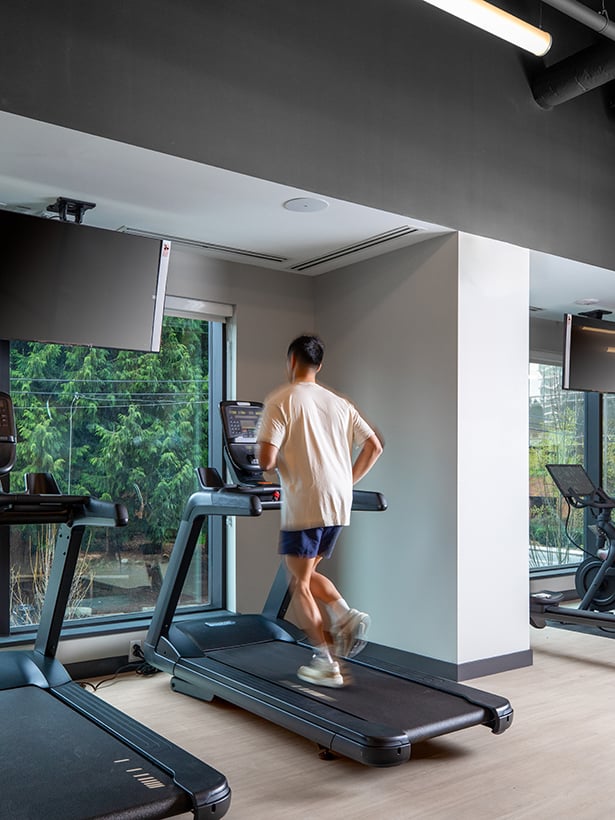 Man running on a treadmill in a fitness centre