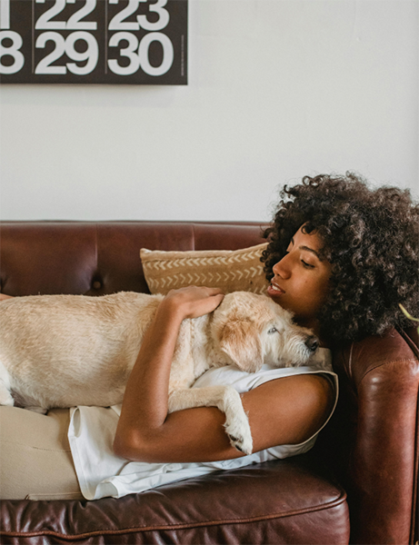 Girl on couch with dog