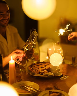 People enjoying drinks and food in a brightly lit room