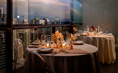 A candelit dinner table on the balcony