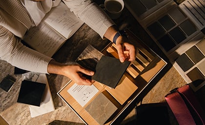 Hands exploring materials