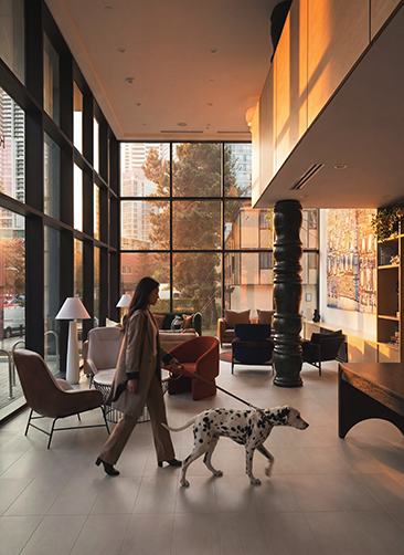 Girl walking through lobby with dog
