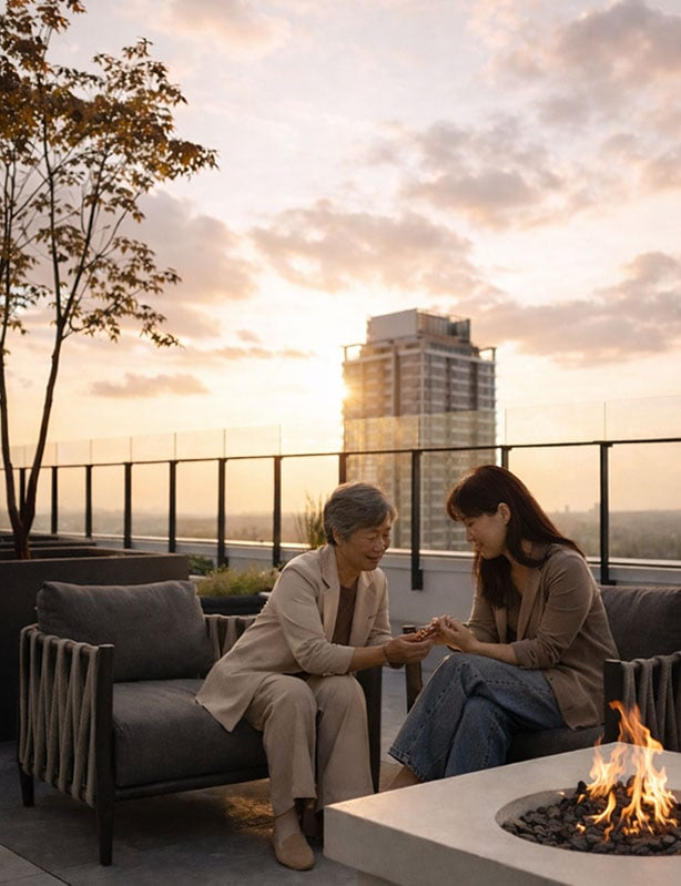 Two people sitting on a patio in front of a fireplace