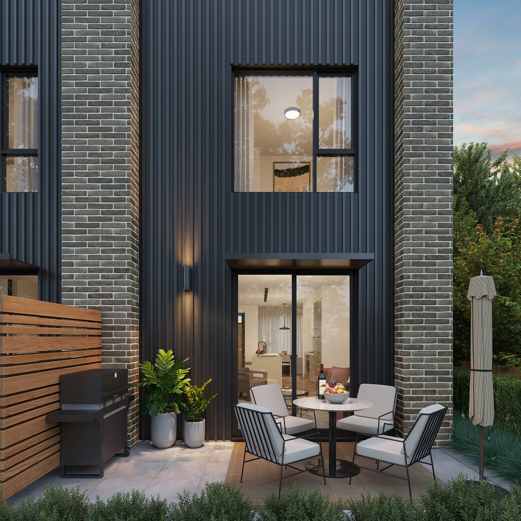 Townhome rear facade with outdoor patio
