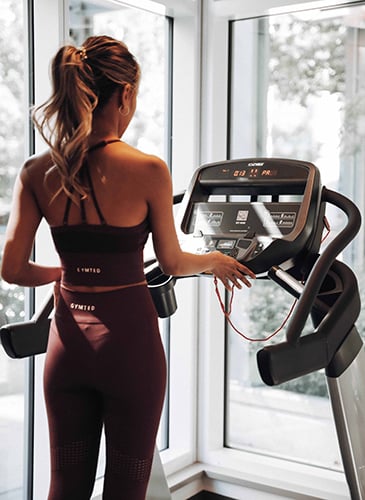 Resident enjoying the fitness studio at Switchmen Olympic Village