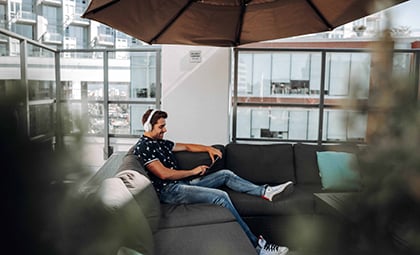 Resident enjoys the rooftop patio at Switchmen rental apartments by Bosa Properties