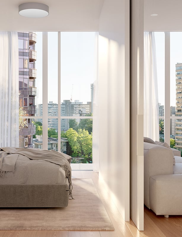 A bedroom with a divider wall