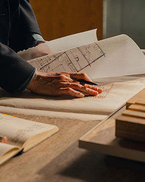 Person with architectural plans