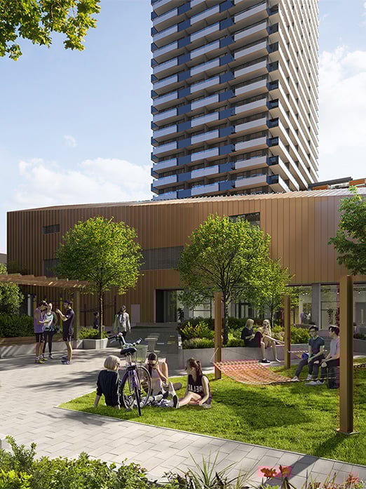 View of people sitting on grass and building