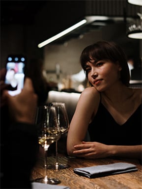 Woman posing for a photo at dinner