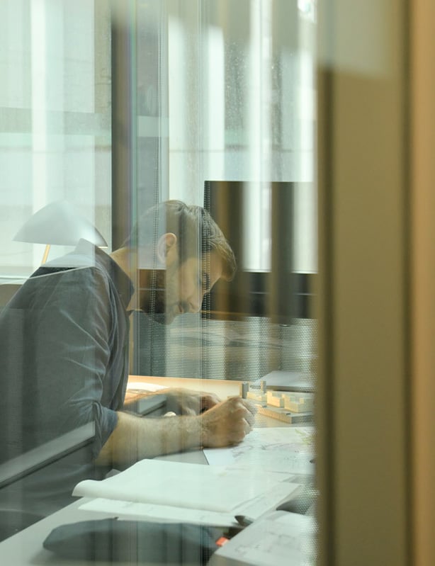 Man Writing in Office Space