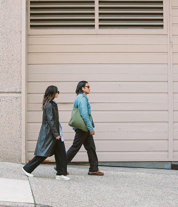 Two people walking on the street