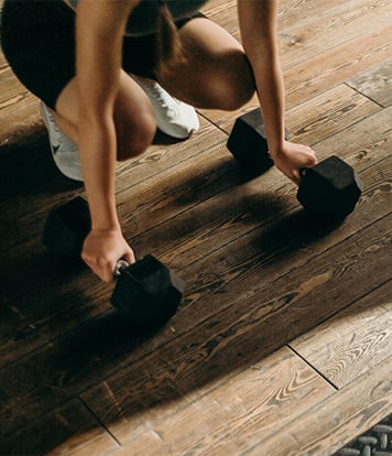 Person picking up weights