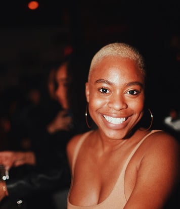 Girl smiling getting her picture taken