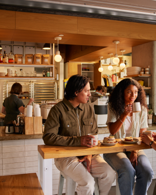 Man and woman enjoying themselves at a bar