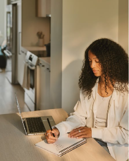 Girl at desk writing