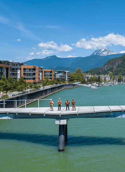Men standing on a bridge