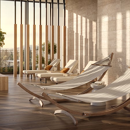 Lounge chairs in amenity room with sunlight pouring through the window