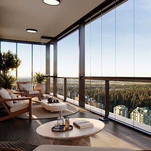 Inside the Lumon balcony at Solhouse 6035 overlooking Burnaby and a blue sky
