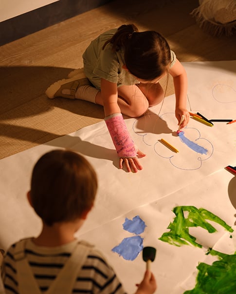 Children painting on the ground
