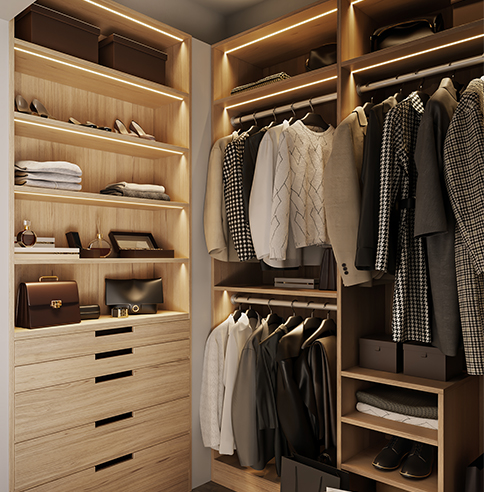 An illuminated walk in closet filled with clothes