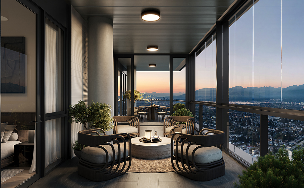 View from Solhouse 6035's balcony overlooking Burnaby with a dimly lit sky and mountains in the background