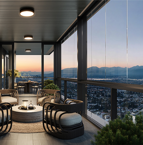 Enclosed balcony at Solhouse overlooking dimly lit Vancouver