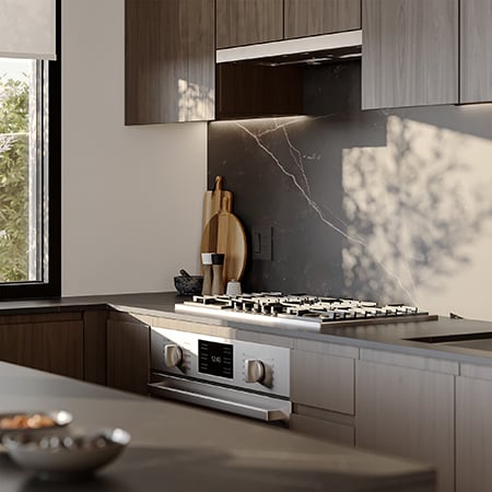 Kitchen counter with stove in a dark colour scheme