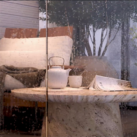 Closeup of rainy balcony with a cozy seat, tea, and patio table