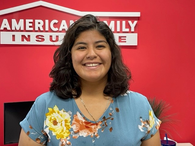 a person smiling for the camera