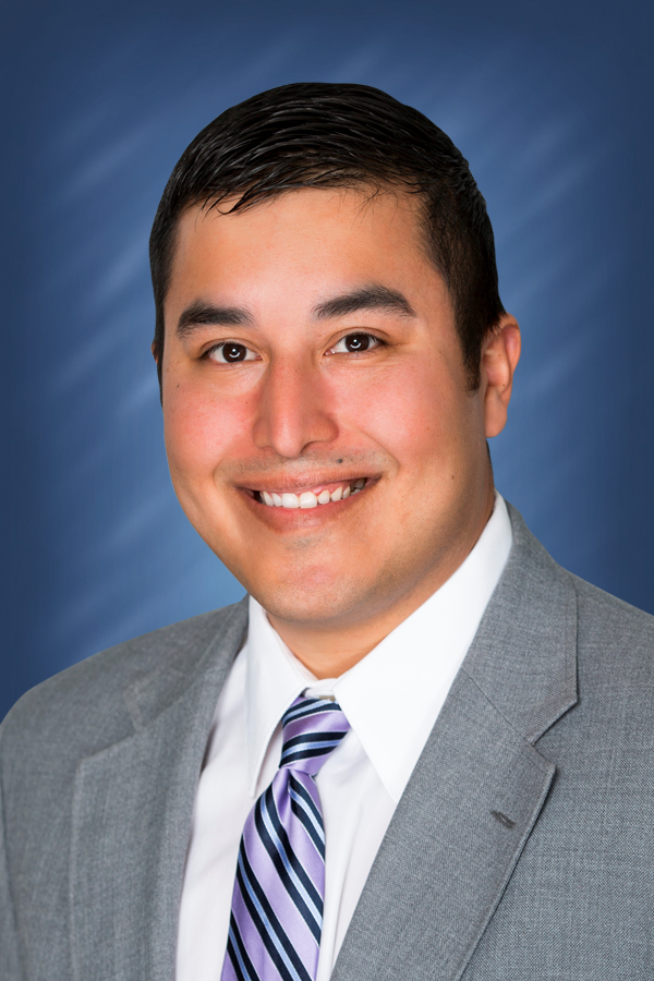 a man in a suit smiling