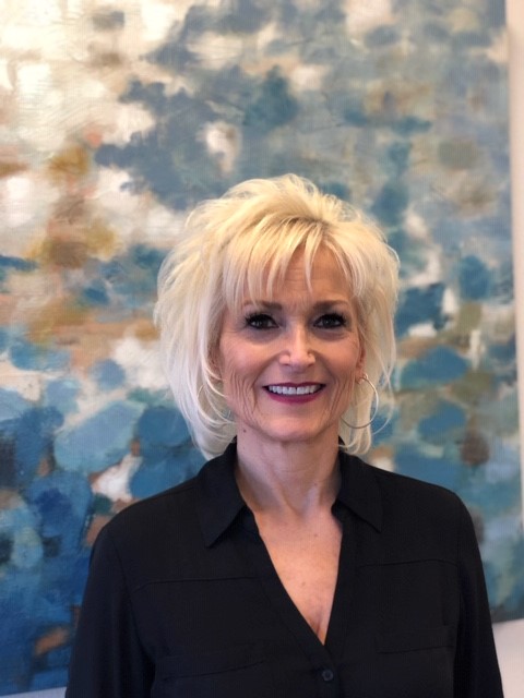 a woman smiling for the camera