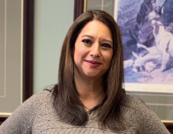 a woman smiling for the camera