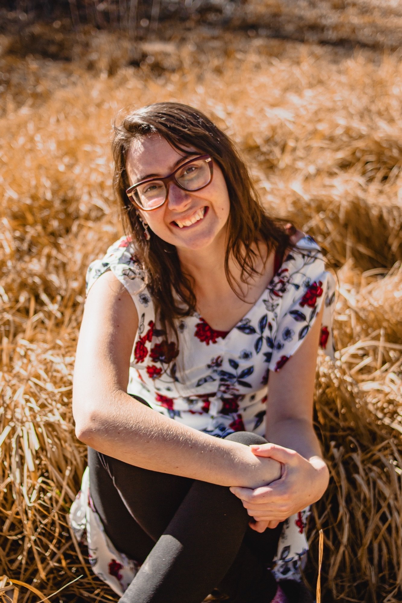 woman sitting in a field