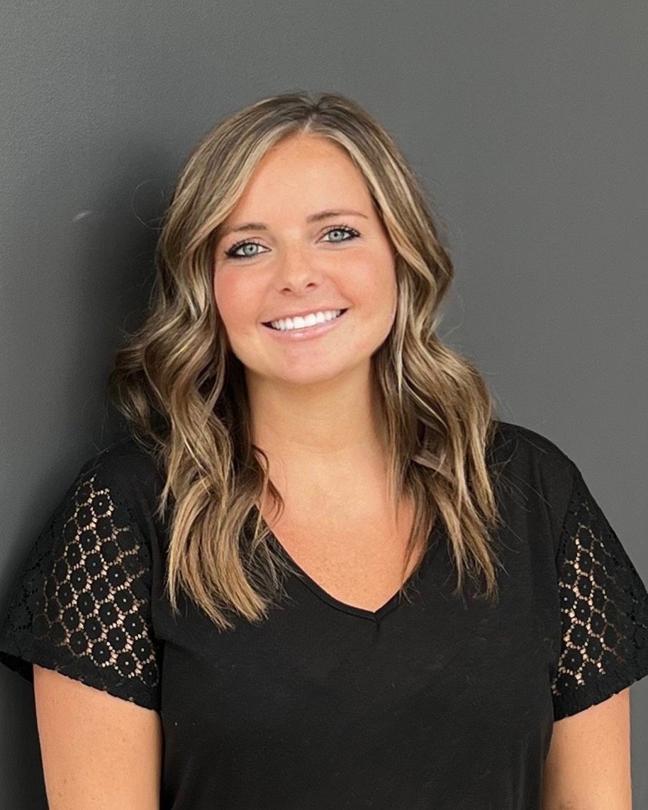 a woman smiling for the camera
