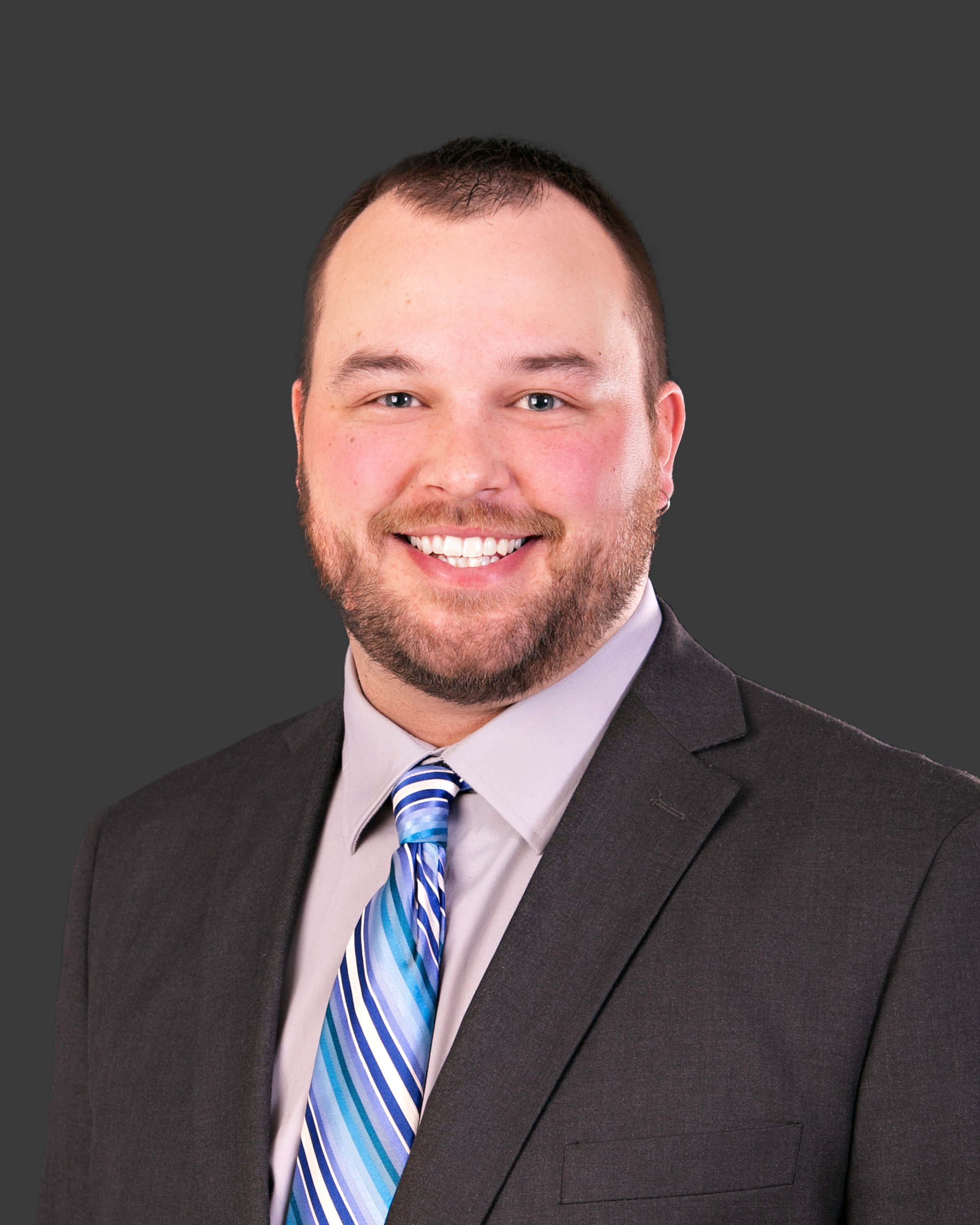 a man in a suit smiling