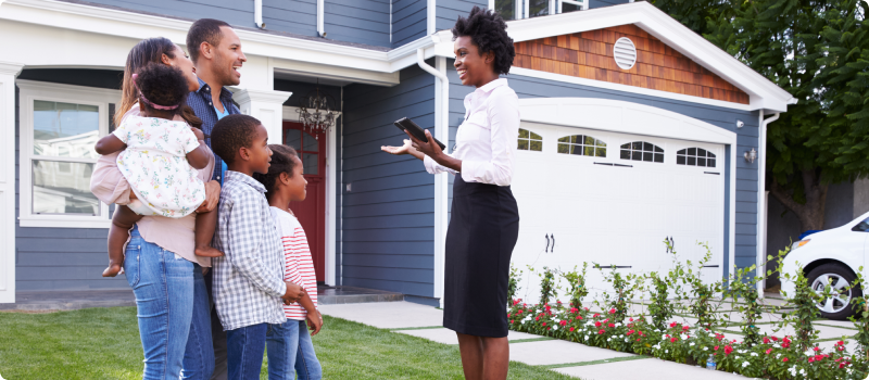 Realtor showing a house to a family