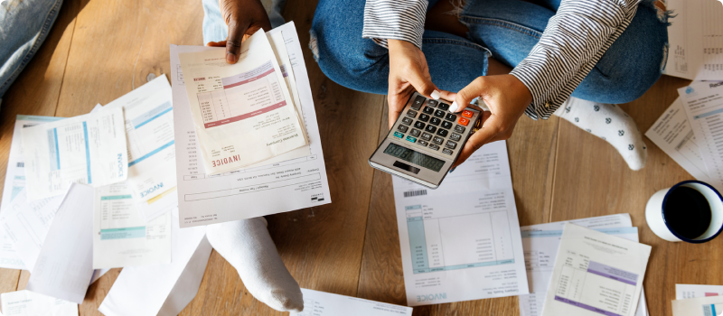 two people looking over their bills