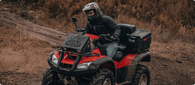 A person riding an ATV on a trial.