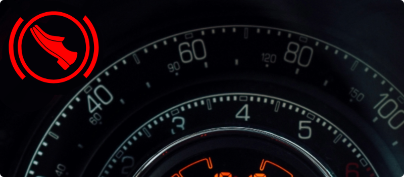 A close-up of a car's Automatic Shift Lock/Engine Start Indicator warning light illuminated.