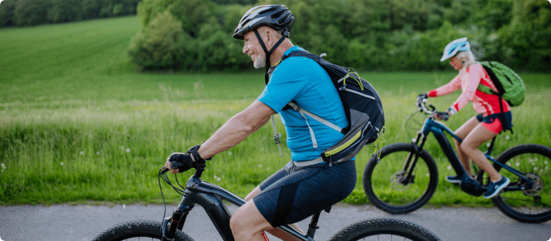 A couple going for an e-bike ride.