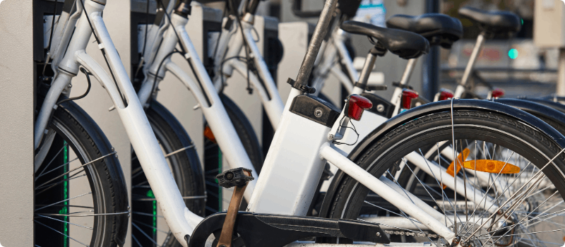 A row of e-bikes for rent.