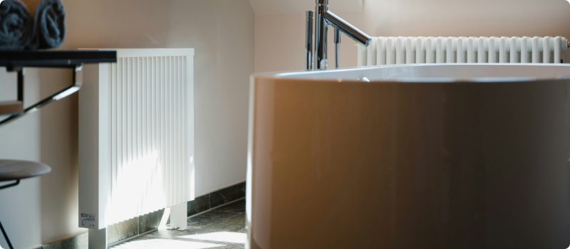Two heating systems installed in a bathroom.