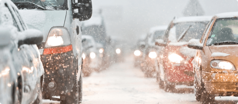 Cars driving in the snow.