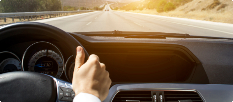 A person driving on an open road.