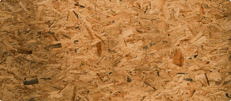 A close-up of oriented strand board for home insulation. 