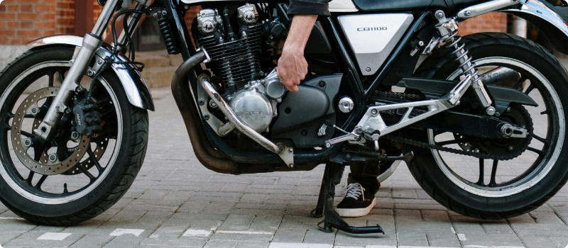 A motorcycle on a stand, being worked on.